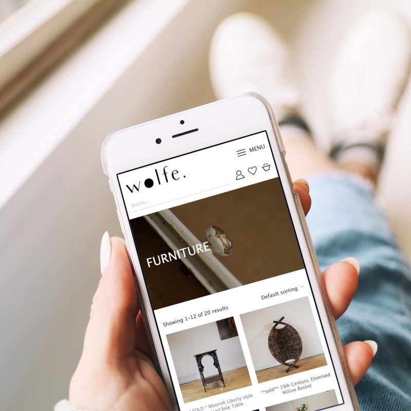 wolfe curated responsive website on mobile device